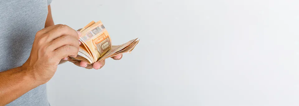 man holding money notes in hand